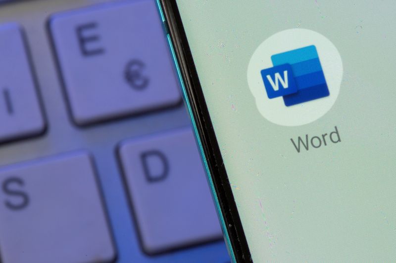 &copy; Reuters. FILE PHOTO: Microsoft Word app is seen on the smartphone placed on the keyboard in this illustration taken, July 26, 2021. REUTERS/Dado Ruvic/Illustration