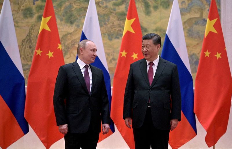 &copy; Reuters. Vladimir Poutine assiste à une réunion avec Xi Jinping à Pékin. /Photo prise le 4 février 2022/REUTERS/Sputnik/Aleksey Druzhinin
