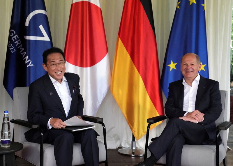 © Reuters. FILE PHOTO: German Chancellor Olaf Scholz, right, and Japan's Prime Minister Fumio Kishida pose for photographers during a bilateral meeting on the sidelines of the G7 summit at Castle Elmau in Kruen, near Garmisch-Partenkirchen, Germany, on Sunday, June 26, 2022. Matthias Schrader/Pool via REUTERS/File Photo