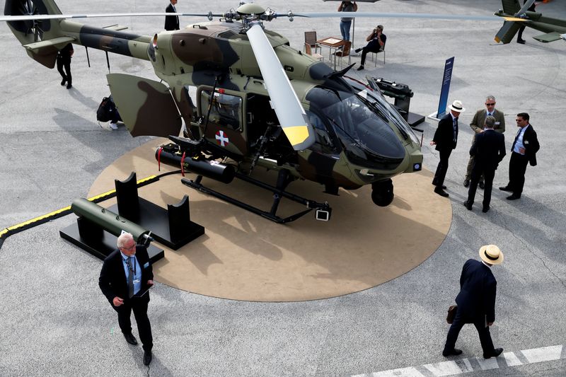 &copy; Reuters. FILE PHOTO: Visitors look at an Airbus Helicopter H145 on static display during the 53rd International Paris Air Show at Le Bourget Airport near Paris, France, June 18, 2019. REUTERS/Pascal Rossignol/File Photo