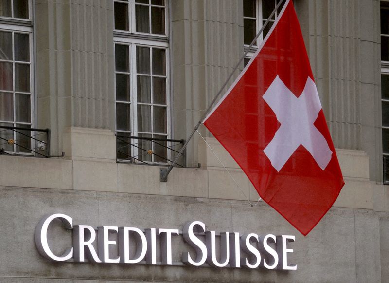 &copy; Reuters. FILE PHOTO: Switzerland's national flag flies above a logo of Swiss bank Credit Suisse in front of a branch office in Bern, Switzerland November 29, 2022. REUTERS/Arnd Wiegmann//File Photo
