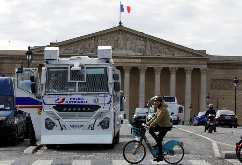 &copy; Reuters. French police stand in front of the National Assembly before debates and votes on two motions of no-confidence against the French government, tabled by centrist group Liot and far-right Rassemblement National party, after the use by French government of t