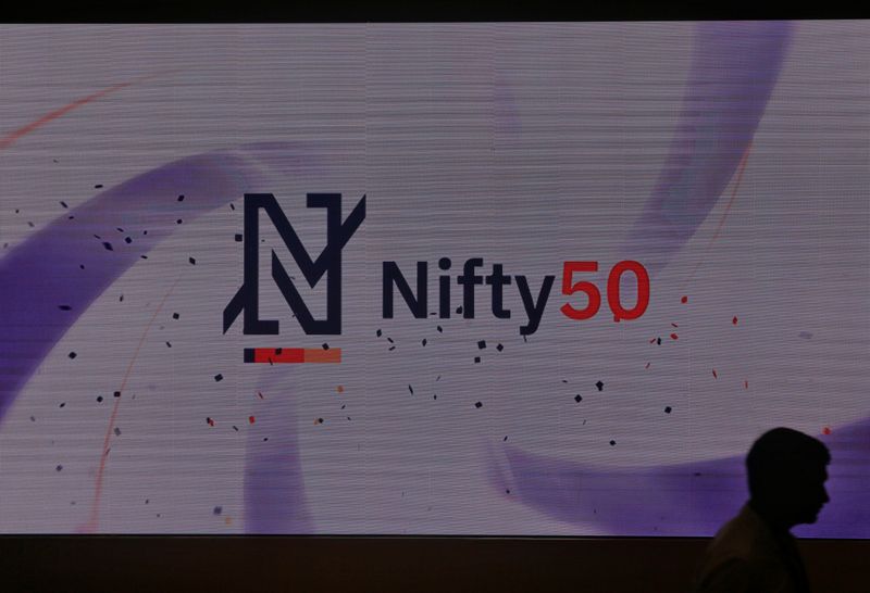 &copy; Reuters. FILE PHOTO: A man walks past a new brand identity for Nifty Indices inside the National Stock Exchange (NSE) building in Mumbai, India, May 28, 2019. REUTERS/Francis Mascarenhas