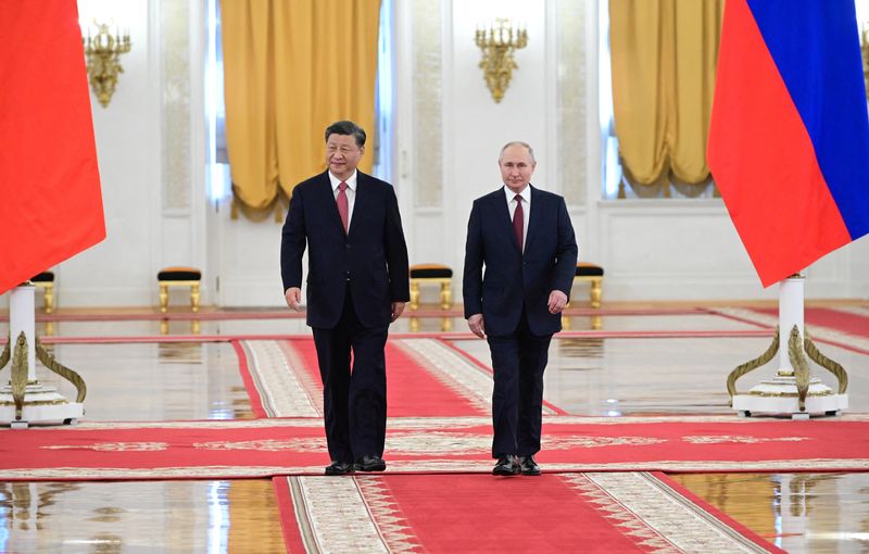 China's Xi appeared more relaxed than Putin in first Moscow meeting, experts say