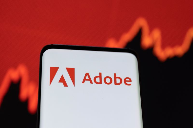 &copy; Reuters. Adobe logo is displayed on a smartphone screen in front of a stock graph in this illustration taken, June 13, 2022. REUTERS/Dado Ruvic/Illustration
