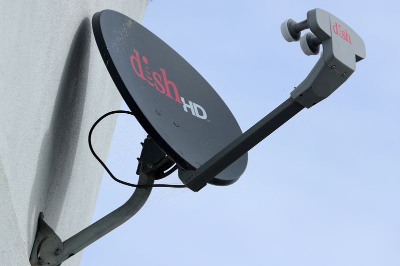 © Reuters. FILE PHOTO: A Dish Network satellite dish is shown on a residential home in Encinitas, California, U.S., November 8, 2017. REUTERS/Mike Blake/File Photo