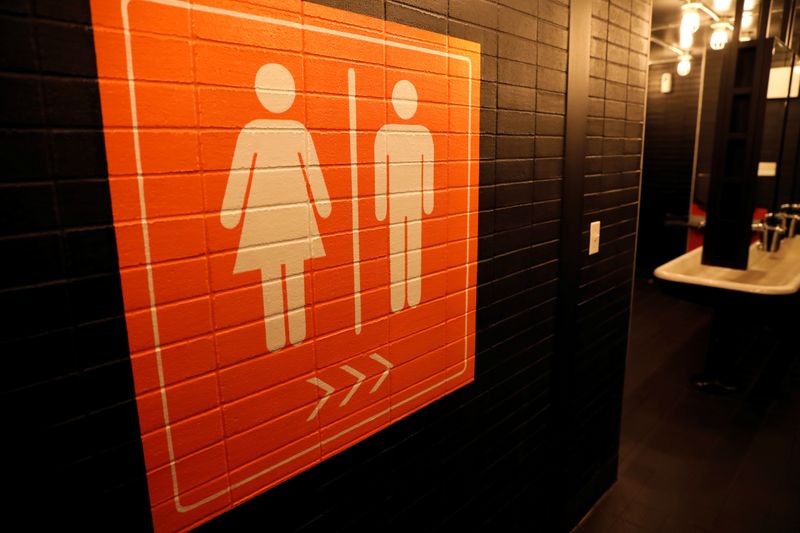 &copy; Reuters. A sign is seen pointing to a gender neutral restroom in New York City, U.S., April 19, 2017. REUTERS/Mike Segar