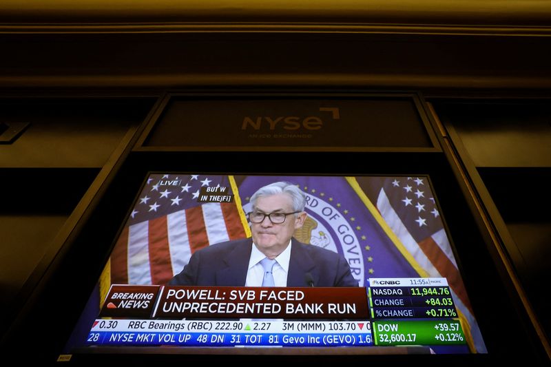 © Reuters. Federal Reserve Chair Jerome Powell is seen as he delivers remarks on a screen, on the floor of the New York Stock Exchange (NYSE) in New York City, U.S., March 22, 2023.  REUTERS/Brendan McDermid