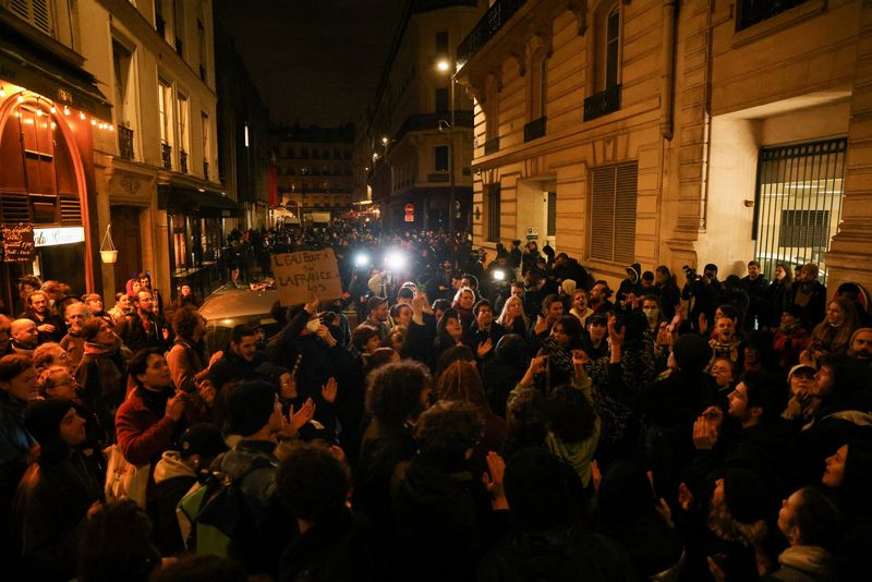 &copy; Reuters. Protesters gather during a demonstration after the pension reform was adopted as the French Parliament rejected two motions of no-confidence against the government, in Paris, France, March 22, 2023. REUTERS/Nacho Doce