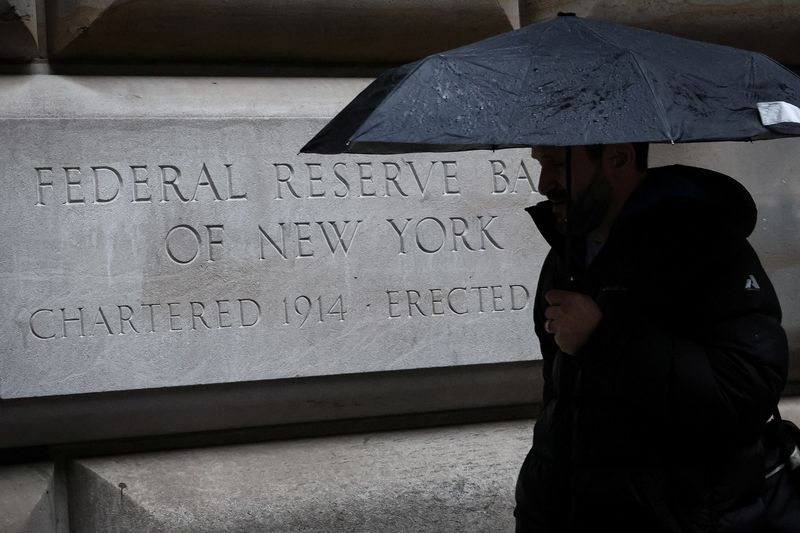 &copy; Reuters. A man passes by The Federal Reserve Bank of New York in New York City, U.S., March 13, 2023.  REUTERS/Brendan McDermid