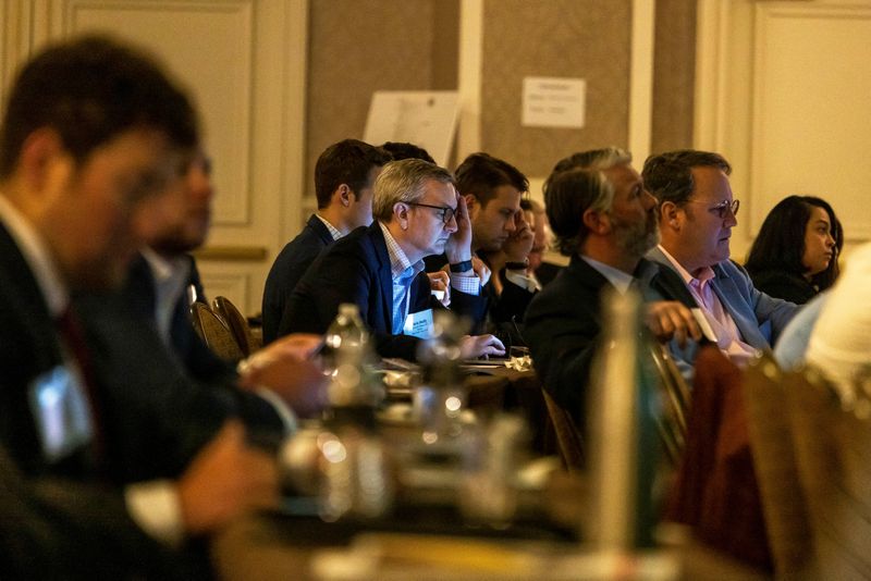 © Reuters. Attendees listen to a panel during a gathering of top global M&A advisors, including Wall Street's most high-profile investment bankers and lawyers, at the 35th Annual Tulane Corporate Law Institute in New Orleans, Louisiana, U.S., March 23, 2023.  REUTERS/Kathleen Flynn