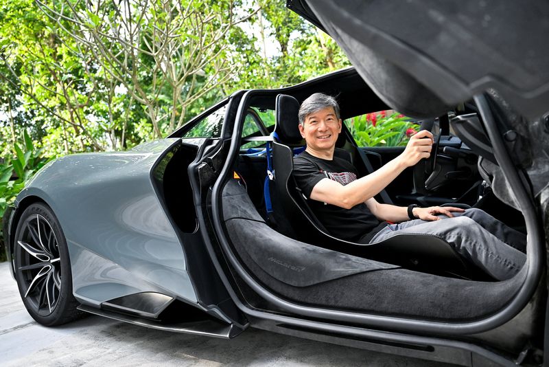 &copy; Reuters. Eu Gene Goh poses for a picture in his McLaren 765LT in Singapore March 11, 2023. REUTERS/Caroline Chia
