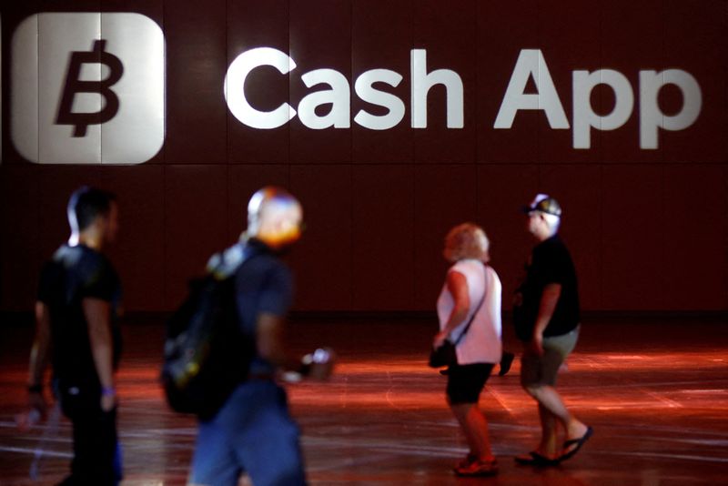 © Reuters. FILE PHOTO: The logo of Cash App is seen at the main hall during the Bitcoin Conference 2022 in Miami Beach, Florida, U.S. April 6, 2022. REUTERS/Marco Bello/File Photo
