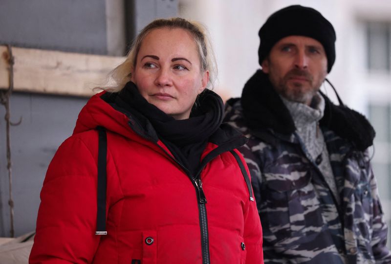 &copy; Reuters. FILE PHOTO: Elena Kolbasnikova and Max Schlund, originally called Rostislav Teslyuk, organisers of pro-Russia rallies, stand on stage at a rally in Cologne, Germany, December 4, 2022.   REUTERS/Stringer