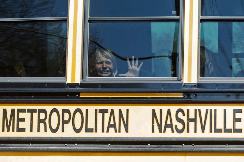© Reuters. A child weeps while on the bus leaving The Covenant School, following a mass shooting at the school in Nashville, Tennessee, U.S., March 27, 2023. Nicole Hester/USA Today Network via REUTERS