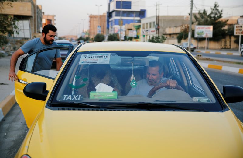 &copy; Reuters. FILE PHOTO: A customer enters one of Careem cars in Mosul, Iraq September 25, 2019. Picture taken September 25, 2019. REUTERS/Abdullah Rashid
