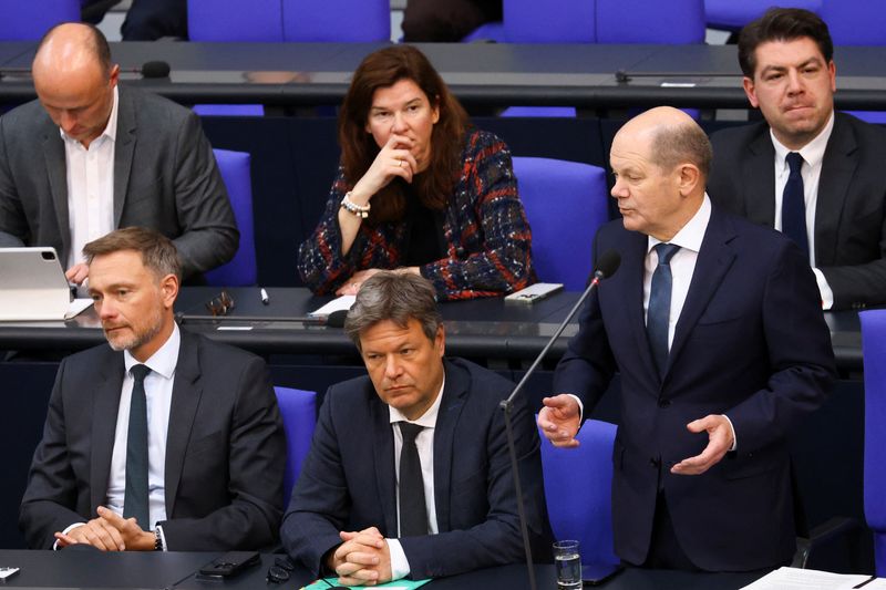 &copy; Reuters. German Chancellor Olaf Scholz answers questions from lawmakers next to German Economy and Climate Minister Robert Habeck and German Finance Minister Christian Lindner during a session of the lower house of parliament Bundestag, in Berlin, Germany, March 2