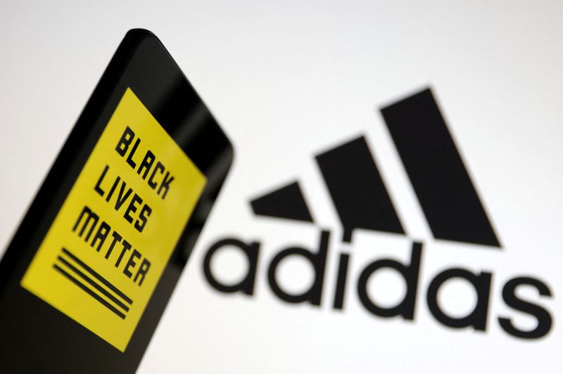 © Reuters. Illustration shows Adidas and Black Lives Matter logos in this illustration taken March 29, 2023. REUTERS/Dado Ruvic/Illustration