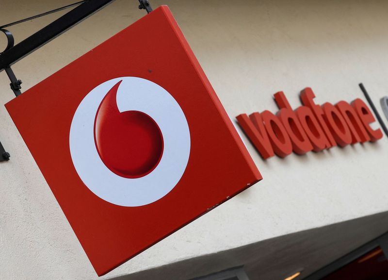 &copy; Reuters. FILE PHOTO: Branding hangs outside a Vodafone shop in Oxford, Britain, May 16, 2017. REUTERS/Toby Melville