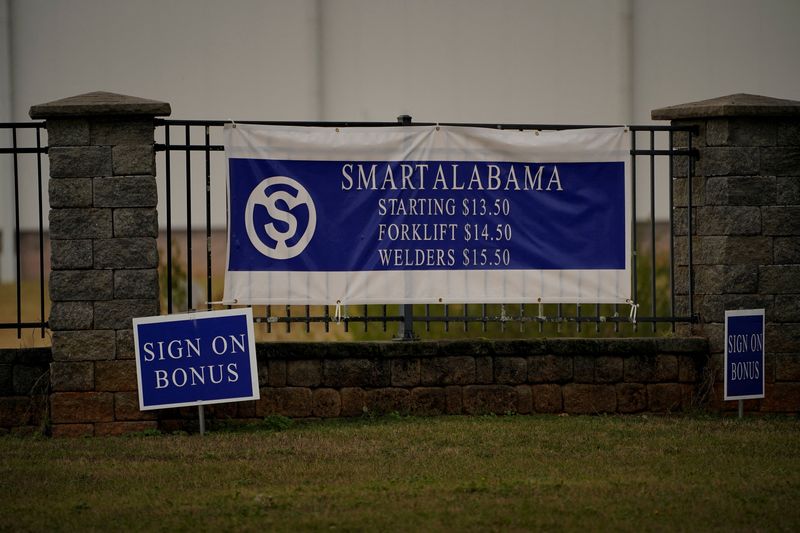 &copy; Reuters. FILE PHOTO: Signs advertise wages and bonuses in front of the SMART Alabama manufacturing facility in Luverne, Alabama, U.S., December 4, 2022.   REUTERS/Cheney Orr