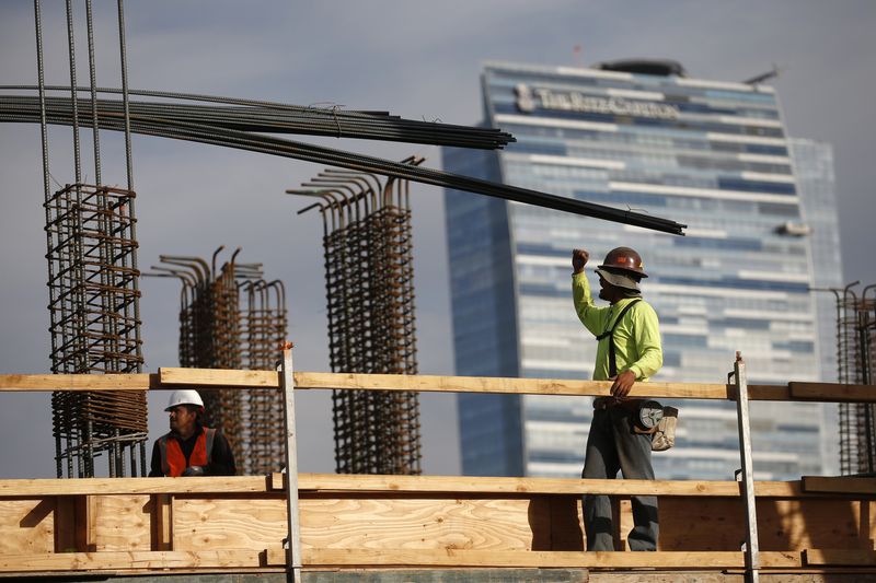 &copy; Reuters. FILE PHOTO: Men work on a construction site for a luxury apartment complex in downtown Los Angeles, California March 17, 2015. REUTERS/Lucy Nicholson 