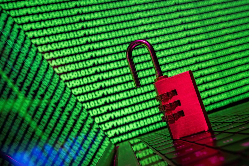 &copy; Reuters. FILE PHOTO: A padlock is seen in front of the word 'spyware' and binary code in this illustration taken May 4, 2022. REUTERS/Dado Ruvic/Illustration