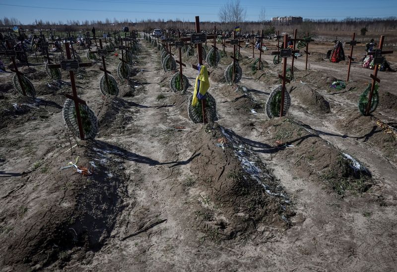 &copy; Reuters. Graves of unidentified people killed by Russian soldiers during occupation of the Bucha town, are seen at the town's cemetery, before the first anniversary of its liberation, amid Russia's attack on Ukraine, in the town of Bucha, outside Kyiv, Ukraine Mar