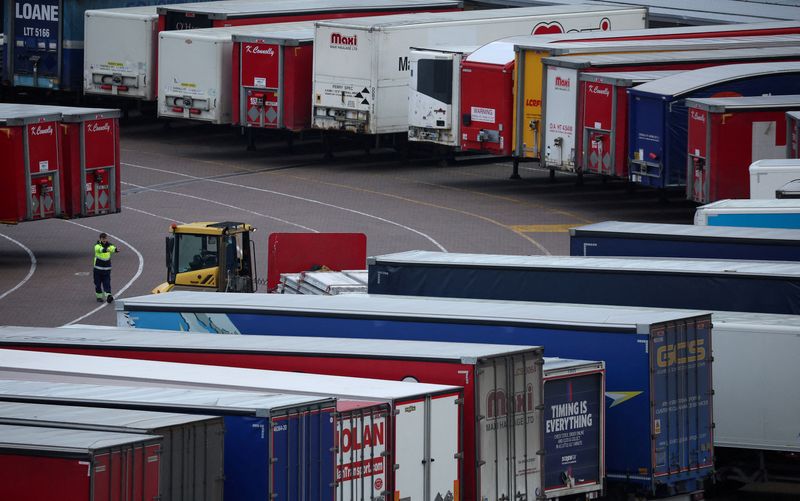 &copy; Reuters. FILE PHOTO: A port worker looks at lorry trailers at the port of Holyhead in Wales, Britain, February 27, 2023. REUTERS/Phil Noble/File Photo
