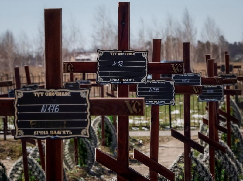 &copy; Reuters. Graves of unidentified people killed by Russian soldiers during occupation of the Bucha town, are seen at the town's cemetery, before the first anniversary of its liberation, amid Russia's attack on Ukraine, in the town of Bucha, outside Kyiv, Ukraine Mar