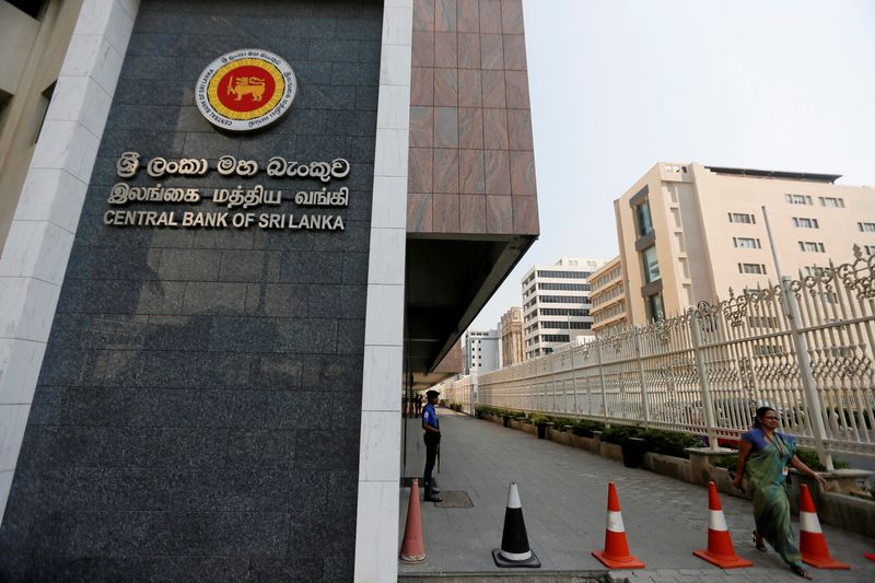 &copy; Reuters. FILE PHOTO: A woman walks past the main entrance of the Sri Lanka's Central Bank in Colombo, Sri Lanka February 7, 2017. REUTERS/Dinuka Liyanawatte