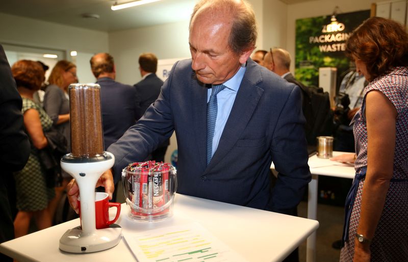 &copy; Reuters. FILE PHOTO: Swiss food giant Nestle Chairman Paul Bulcke checks some Nescafe distribution device during the inauguration of the Nestle Institute of Packaging Sciences in Lausanne, Switzerland, September 12, 2019. REUTERS/Denis Balibouse/File Photo