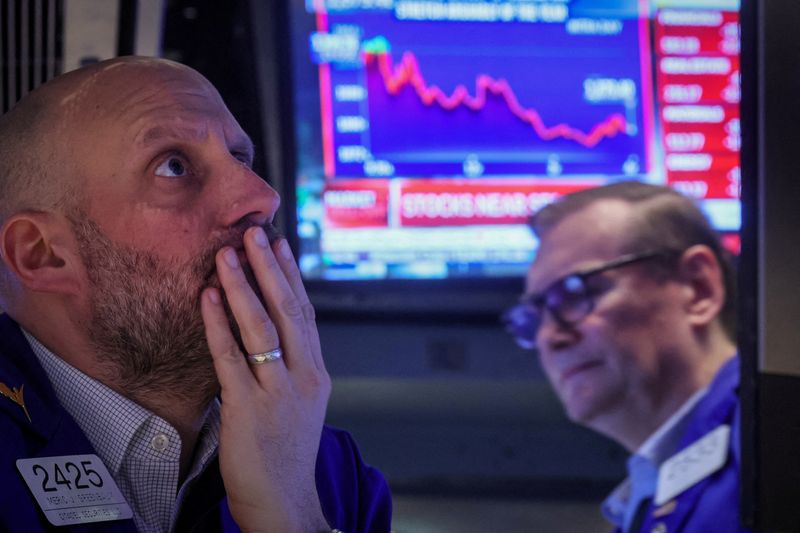 &copy; Reuters. FILE PHOTO: Traders work on the floor of the New York Stock Exchange (NYSE) in New York City, U.S., March 7, 2023.  REUTERS/Brendan McDermid