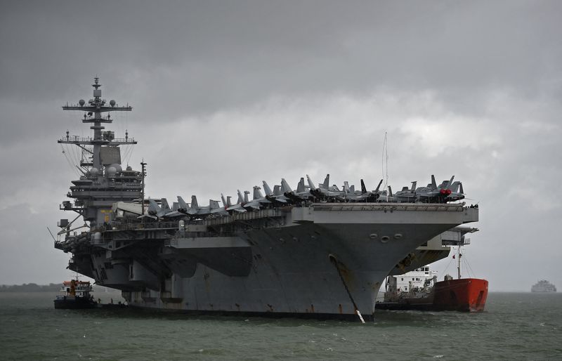 © Reuters. FILE PHOTO: The USS George H.W. Bush aircraft carrier is seen anchored off Stokes Bay in the Solent, Britain, July 27, 2017. REUTERS/Hannah McKay/File Photo