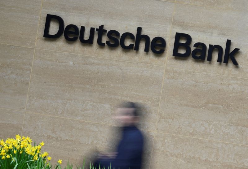 &copy; Reuters. FILE PHOTO: A worker walks past Deutsche Bank offices in London, Britain, March 16, 2023. REUTERS/Toby Melville