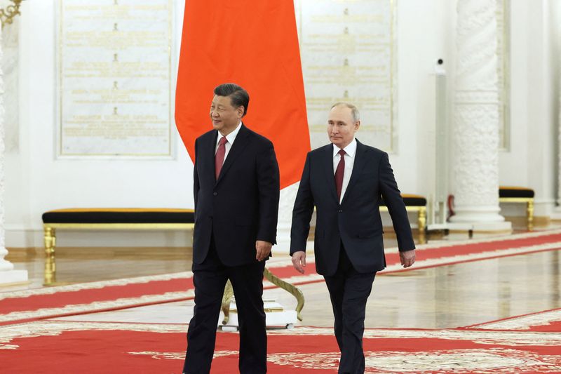 &copy; Reuters. Russian President Vladimir Putin and Chinese President Xi Jinping attend a welcome ceremony before Russia - China talks in narrow format at the Kremlin in Moscow, Russia March 21, 2023. Sputnik/Sergei Karpukhin/Pool via REUTERS  