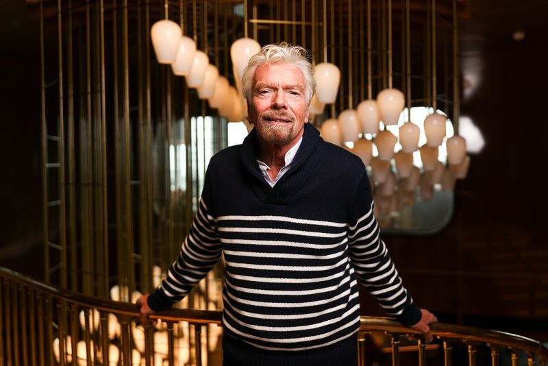 © Reuters. FILE PHOTO: Richard Branson, founder of Virgin Group, poses for a photograph on board of his new cruise liner, the Scarlet Lady at Dover Port in Dover, Britain, February 21, 2020. REUTERS/Simon Dawson