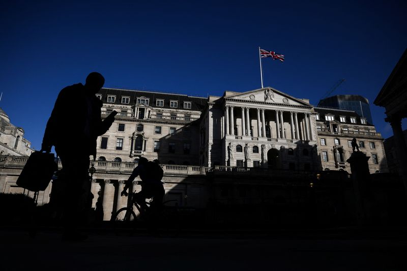 &copy; Reuters. People walk outside the Bank of England in the City of London financial district in London, Britain, March 23, 2023. REUTERS/Henry Nicholls