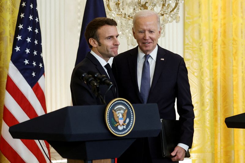 &copy; Reuters. FILE PHOTO: French President Emmanuel Macron greets U.S. President Joe Biden at the conclusion of their joint news conference in the East Room of the White House in Washington, U.S., December 1, 2022. REUTERS/Jonathan Ernst/File Photo