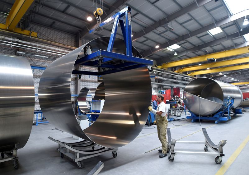 &copy; Reuters. FILE PHOTO: A worker at German manufacturer of silos and liquid tankers, Feldbinder Special Vehicles, moves rolls of aluminium at the company's plant in Winsen, Germany, July 10, 2018. Picture taken July 10, 2018. REUTERS/Fabian Bimmer/File Photo