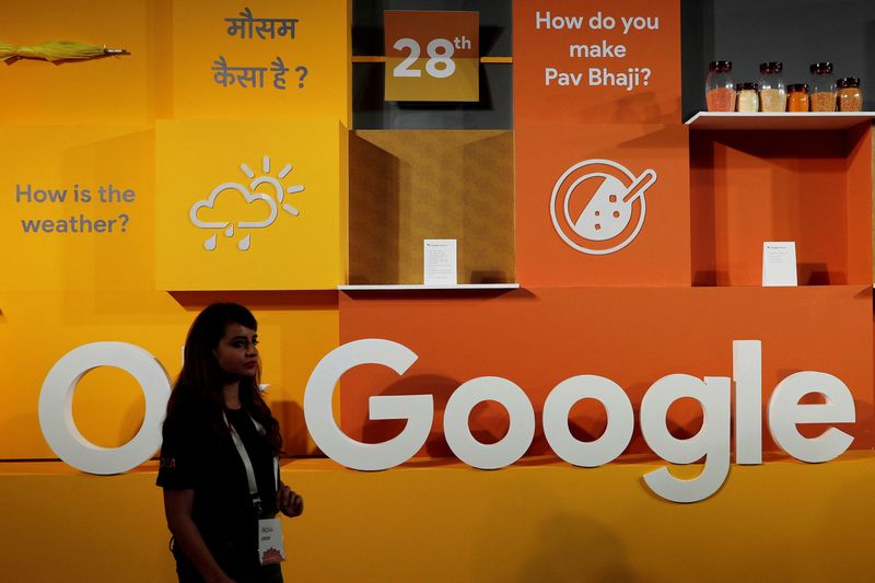 &copy; Reuters. FILE PHOTO: A woman walks past the logo of Google during an event in New Delhi, India, August 28, 2018. REUTERS/Adnan Abidi