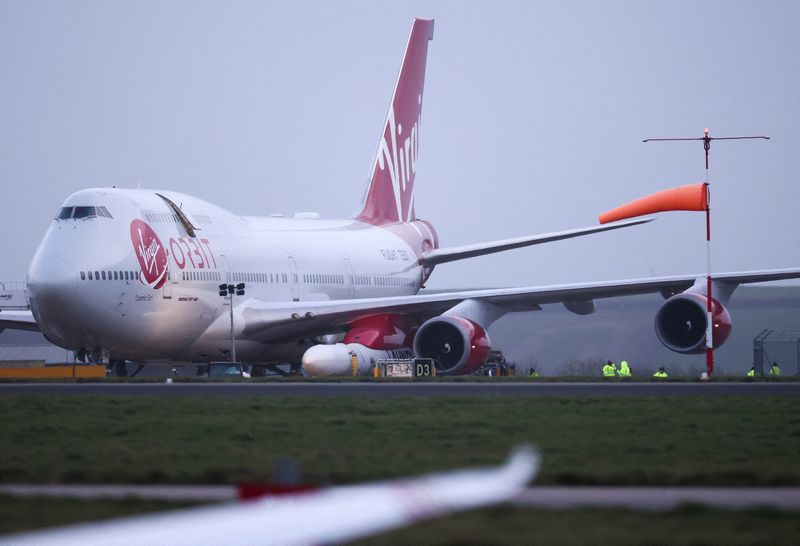 &copy; Reuters. FILE PHOTO: Cosmic Girl, a Virgin Boeing 747-400 aircraft sits on the tarmac with Virgin Orbit's LauncherOne rocket attached to the wing, ahead of the first UK launch tonight, at Spaceport Cornwall at Newquay Airport in Newquay, Britain, January 9, 2023. 