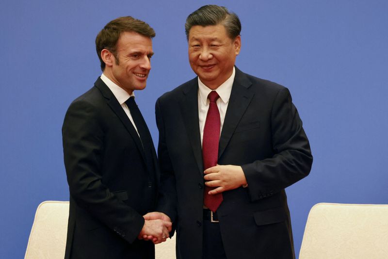 With lavish treatment of Macron, China's Xi woos France to "counter" U.S.