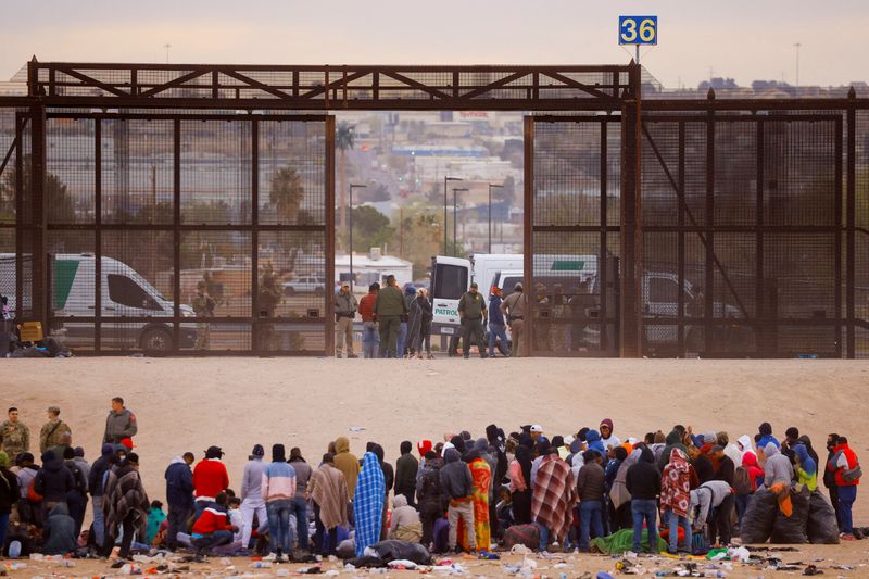 &copy; Reuters. FILE PHOTO: Migrants stand near the border wall after crossing the Rio Bravo river with the intention of turning themselves in to the U.S. Border Patrol agents, as seen from Ciudad Juarez, Mexico March 30, 2023. REUTERS/Jose Luis Gonzalez 