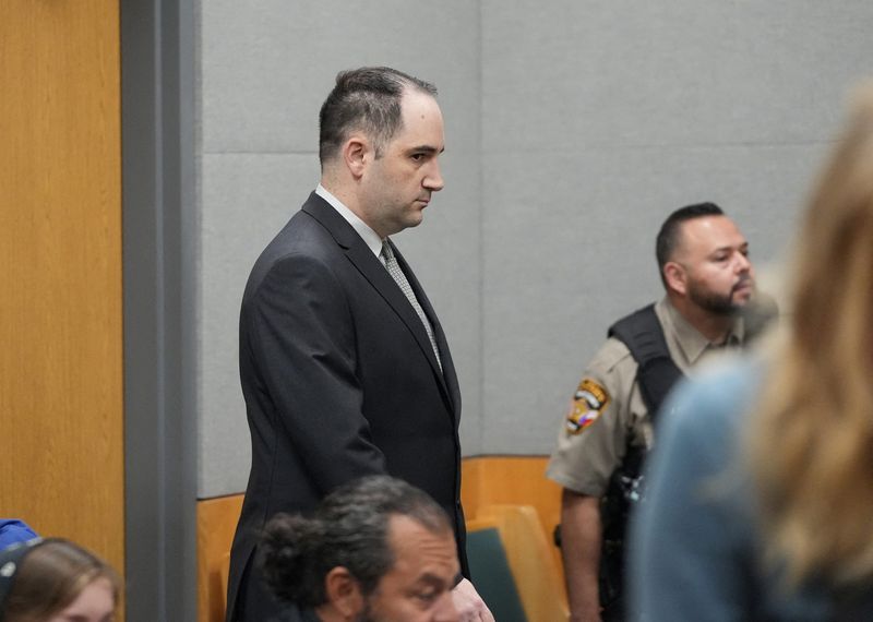© Reuters. Daniel Perry walks into the courtroom moments before he was convicted of murder in the July 2020 shooting death of Garrett Foster at a Black Lives Matter protest, at the Blackwell-Thurman Criminal Justice Center in Austin, Texas, U.S. April 7, 2023. Jay Janner/USA Today Network via REUTERS 