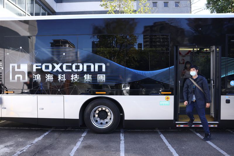 &copy; Reuters. FILE PHOTO: A man walks out from a Foxtron Model T eBus during an organized media visit to Foxconn's headquarters, in New Taipei City, Taiwan December 22, 2022. REUTERS/Annabelle Chih