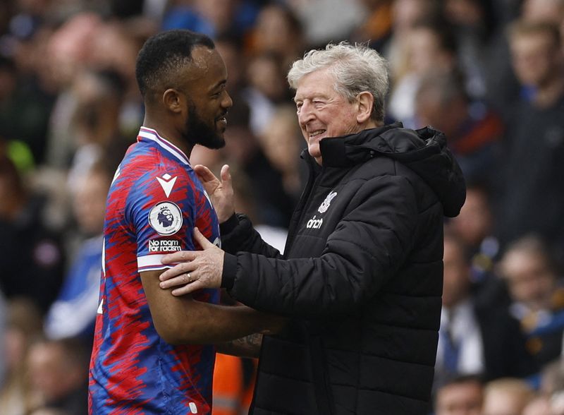 &copy; Reuters. Soccer Football - Premier League - Leeds United v Crystal Palace - Elland Road, Leeds, Britain - April 9, 2023 Crystal Palace's Jordan Ayew with manager Roy Hodgson after being substituted Action Images via Reuters/Jason Cairnduff 