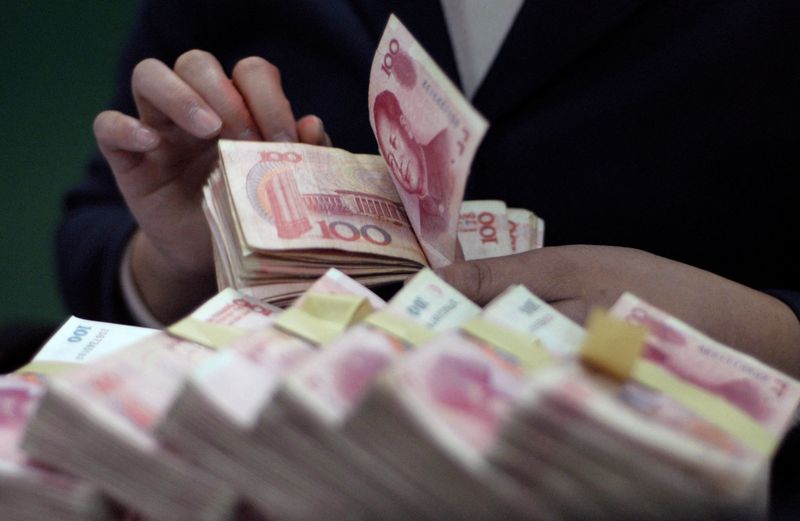 Smaller Chinese banks cut deposit rates on squeezed margins