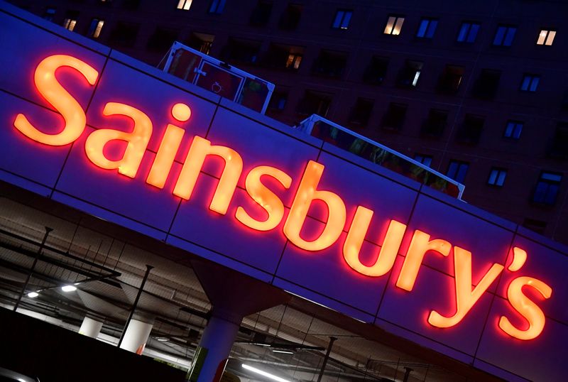 &copy; Reuters. FILE PHOTO: Illuminated signage is seen at a branch of the Sainsbury's supermarket in London, Britain, January 7, 2022. REUTERS/Toby Melville