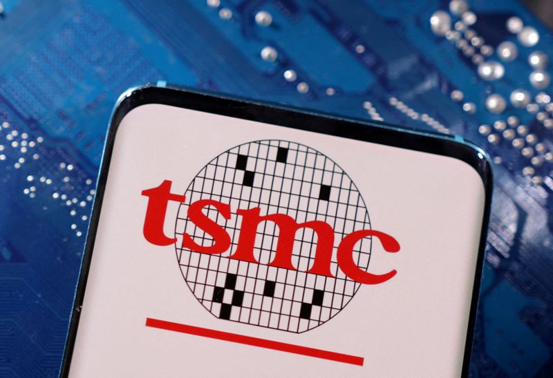 &copy; Reuters. FILE PHOTO: A smartphone with a displayed TSMC (Taiwan Semiconductor Manufacturing Company)  logo is placed on a computer motherboard in this illustration taken March 6, 2023. REUTERS/Dado Ruvic/Illustration