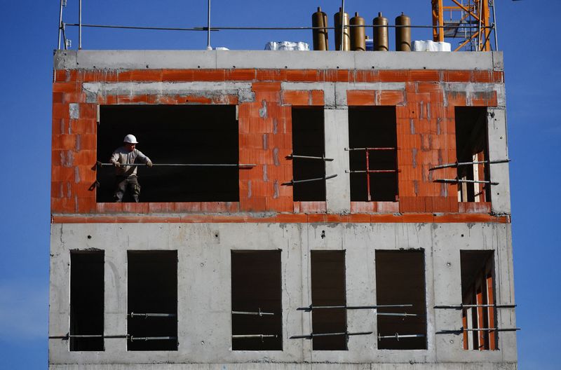 &copy; Reuters. FILE PHOTO: A worker is seen on a building construction site in Ancenis-Saint-Gereon, France, March 15, 2023. REUTERS/Stephane Mahe
